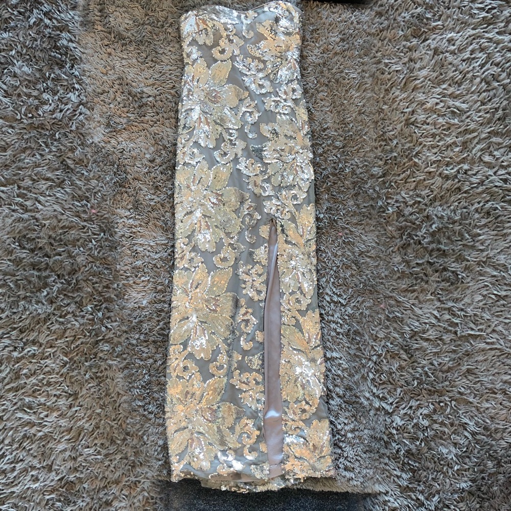 silver floor length fitted ball gown w/ a slit